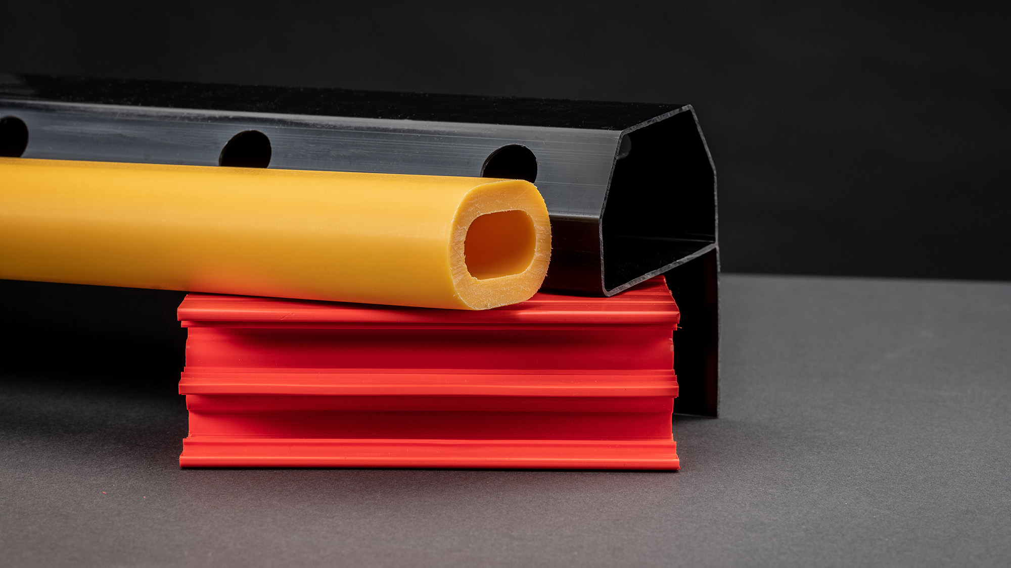 Three different coloured plastic profiles from Condale Plastics, experts in plastic extrusions