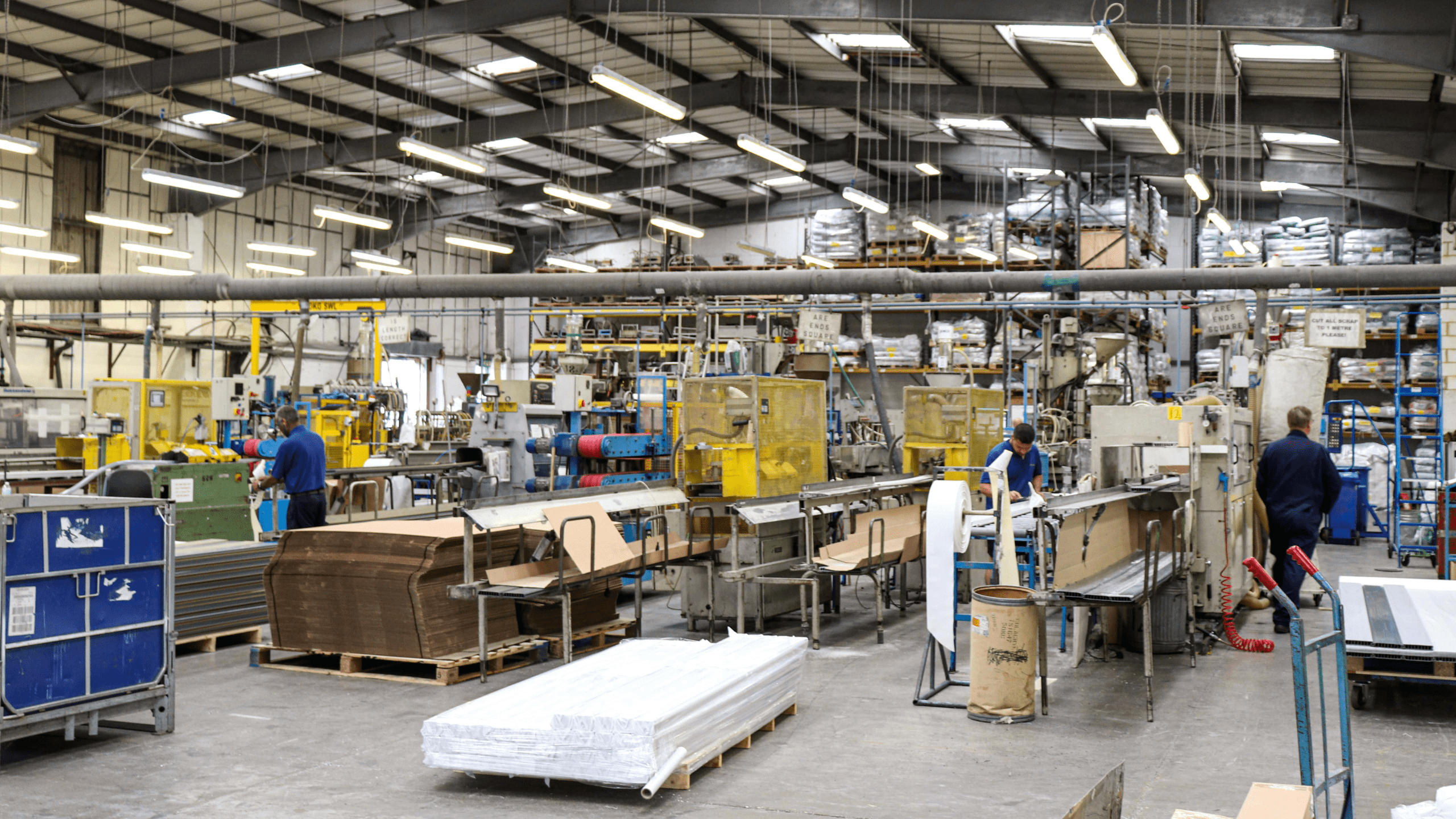 The Condale Plastics team checking the quality of their plastic extrusions in their West Sussex warehouse